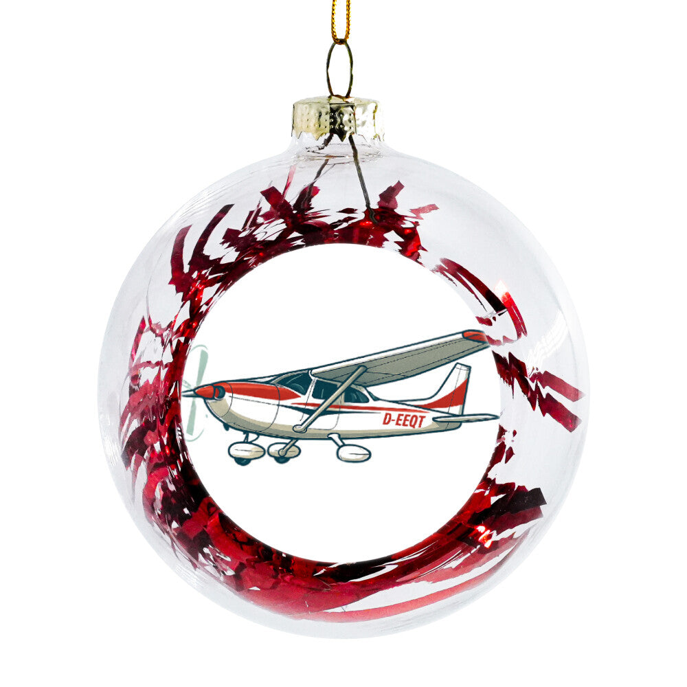 Weihnachtskugel Motorflugzeug auf dem Motorflugzeug erkennt man die Kennung D-EEQT in der Kugel sind Folienstreifen in der Farbe rot